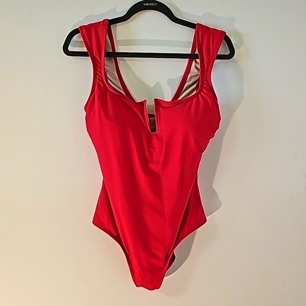 Lona Sol pink one peice bathing suit. Size large Soft light padded cup Excellent
